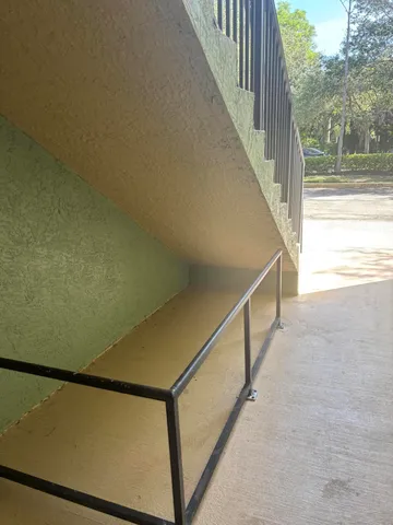 a kitchen with a sink and a stove top oven