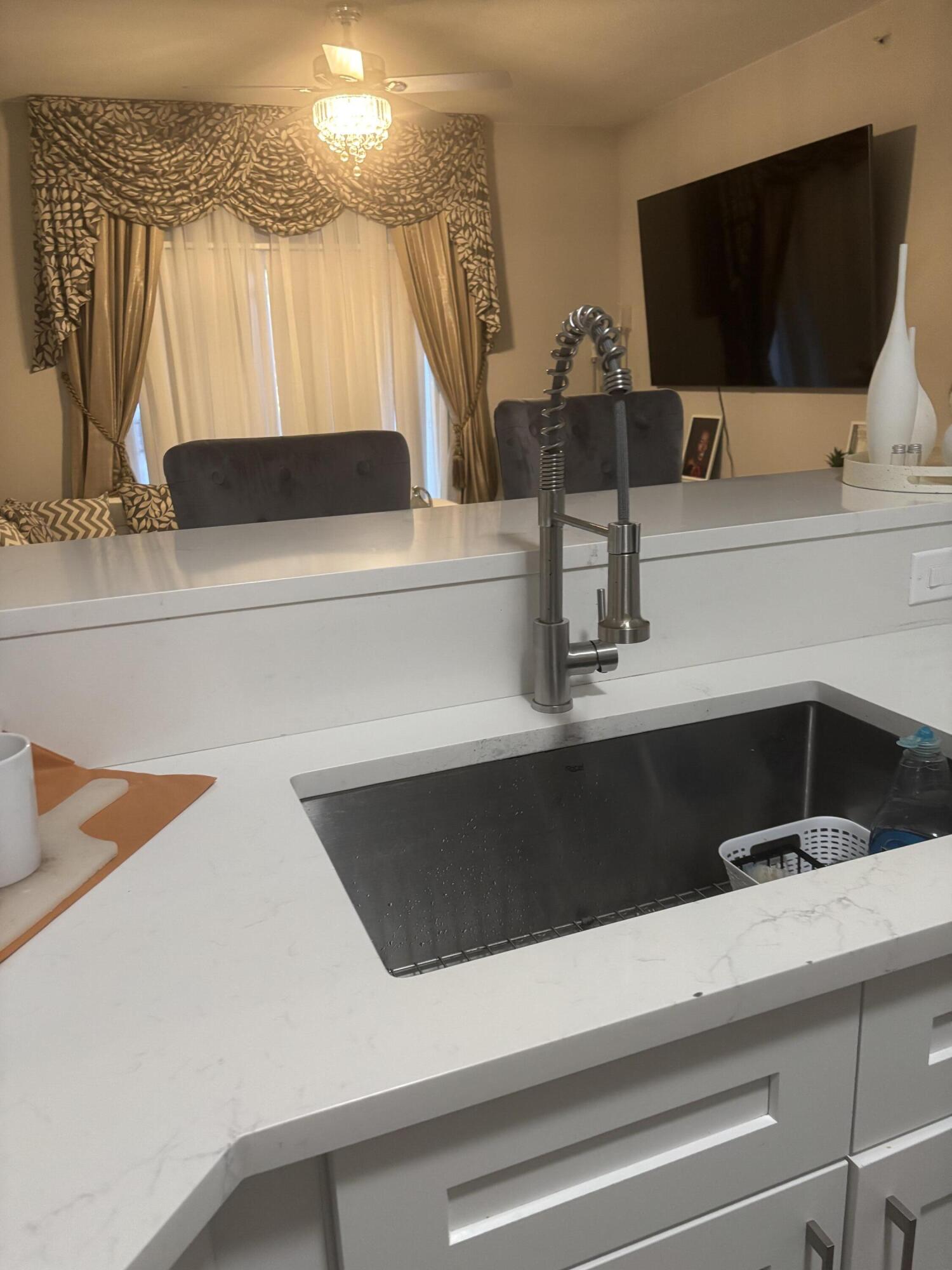350 Crestwood Circle, Unit 106 Royal Palm Beach, FL 33411 - Photo 9 of 28 a bathroom with a sink and a mirror