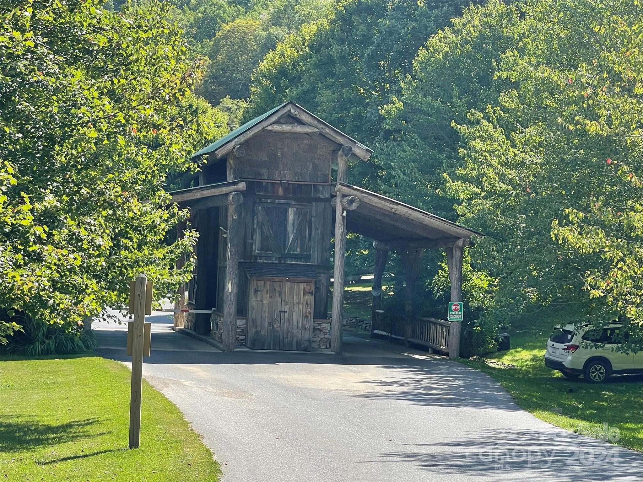 229 Hanging Rock Road Mars Hill, NC 28754 - Photo 21 of 21 a front view of a house with garden