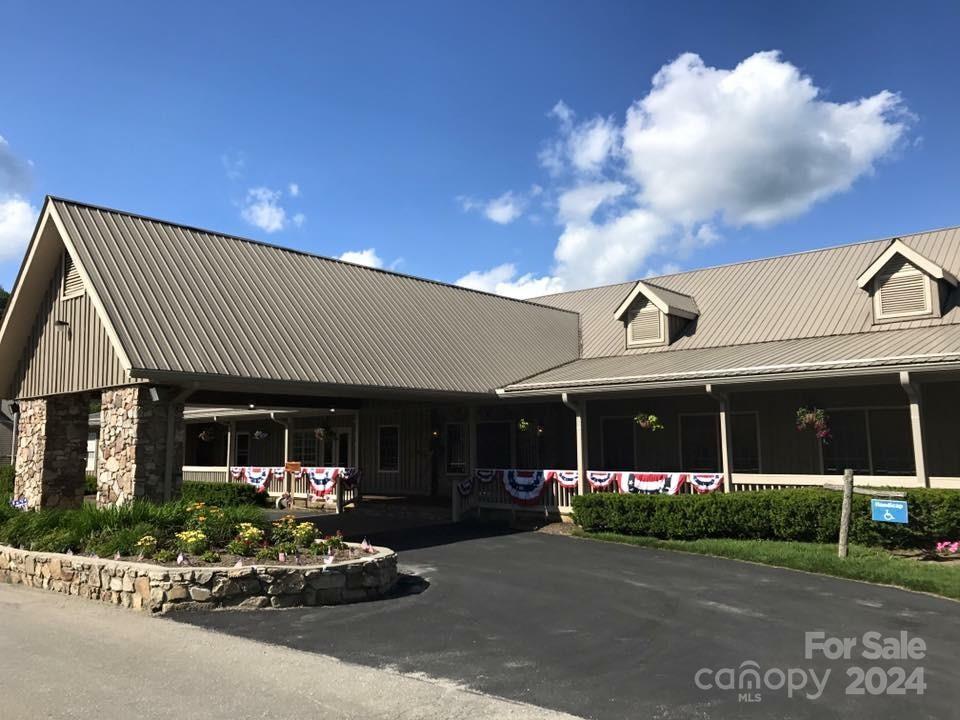 229 Hanging Rock Road Mars Hill, NC 28754 - Photo 9 of 21 a view of a building with sitting area