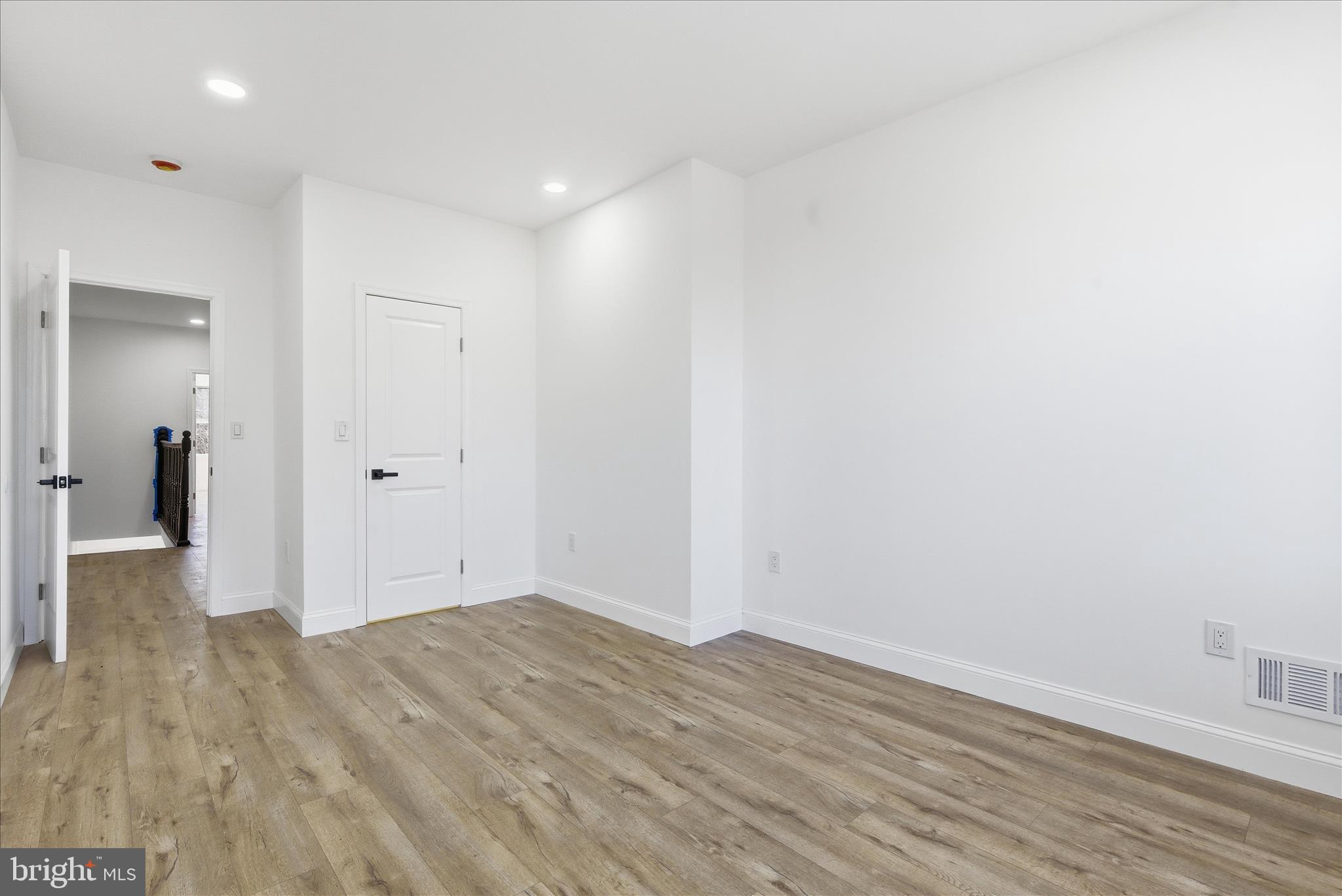 4668 Pimlico Road Baltimore, MD 21215 - Photo 19 of 32 wooden floor in an empty room