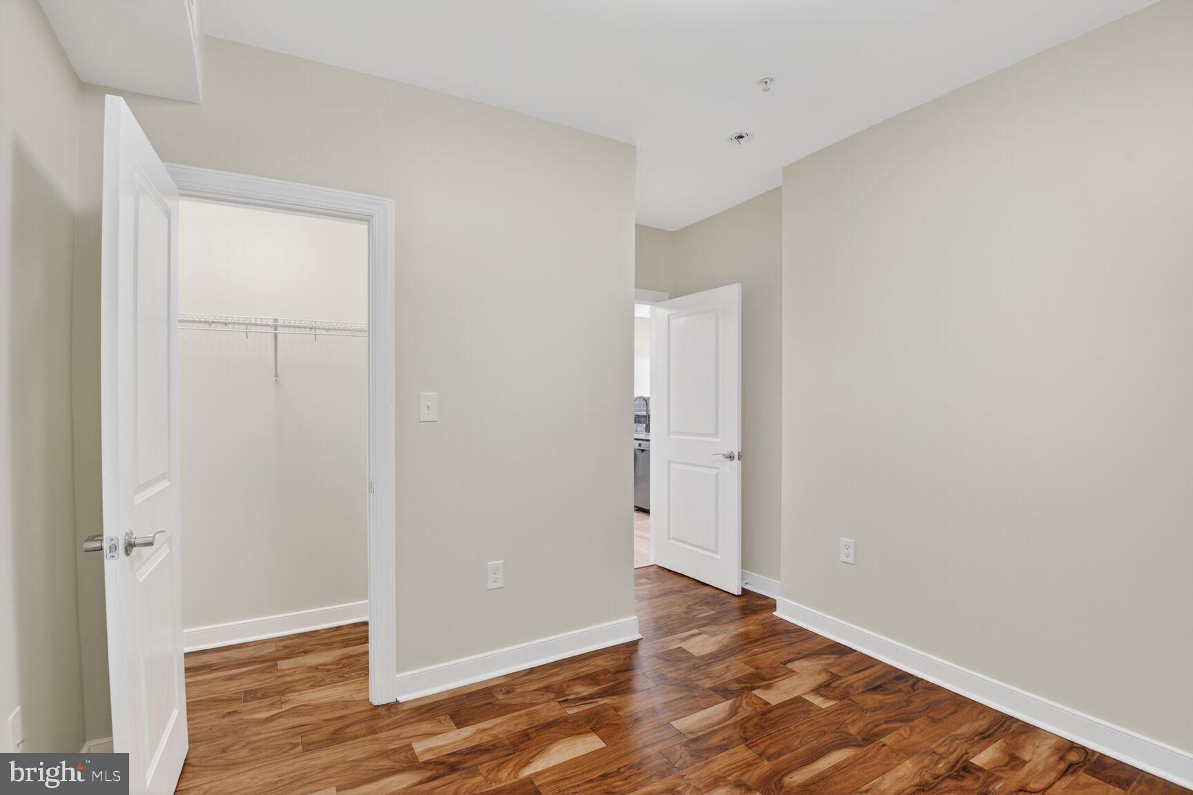 4800 Georgia Avenue Northwest, Unit 205 Washington, DC 20011 - Photo 9 of 15 a view of an empty room with wooden floor