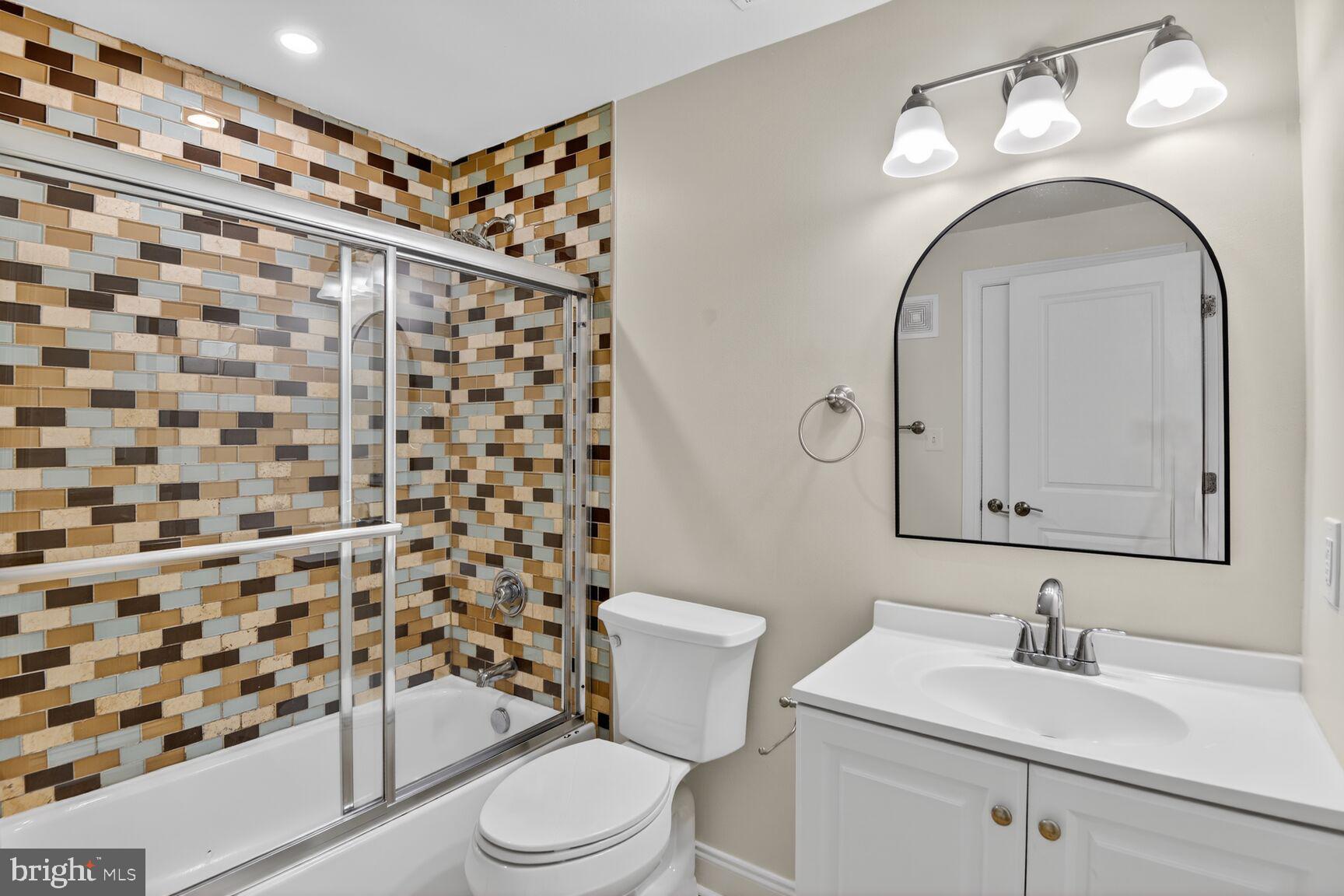 4800 Georgia Avenue Northwest, Unit 205 Washington, DC 20011 - Photo 10 of 15 a bathroom with a sink a toilet and shower