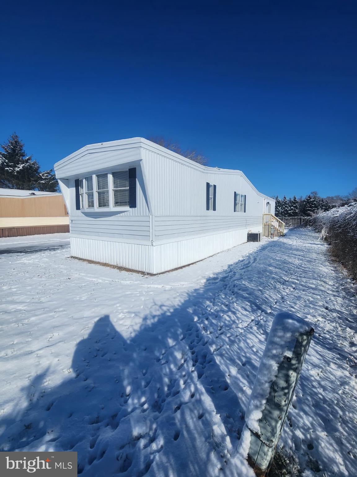 4191 Lake Road, Unit 28 Newfield, NJ 08344 - Photo 2 of 12 a view of a house with a yard