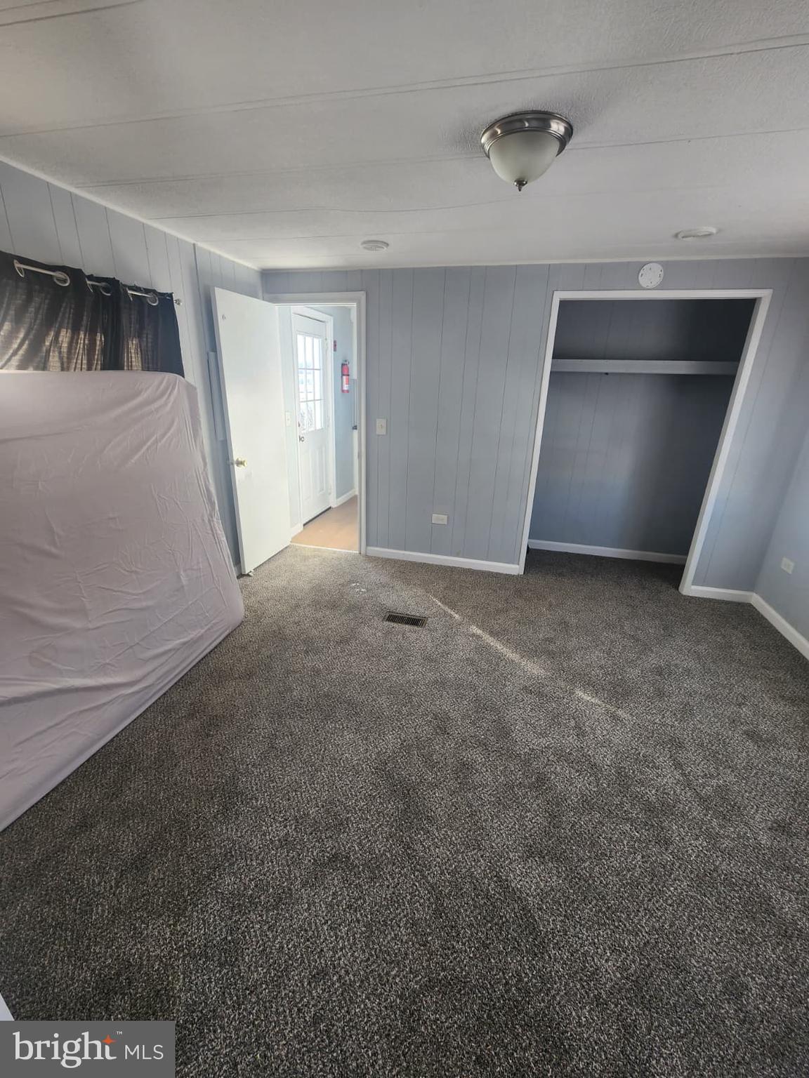 4191 Lake Road, Unit 28 Newfield, NJ 08344 - Photo 4 of 12 a view of empty room with front door