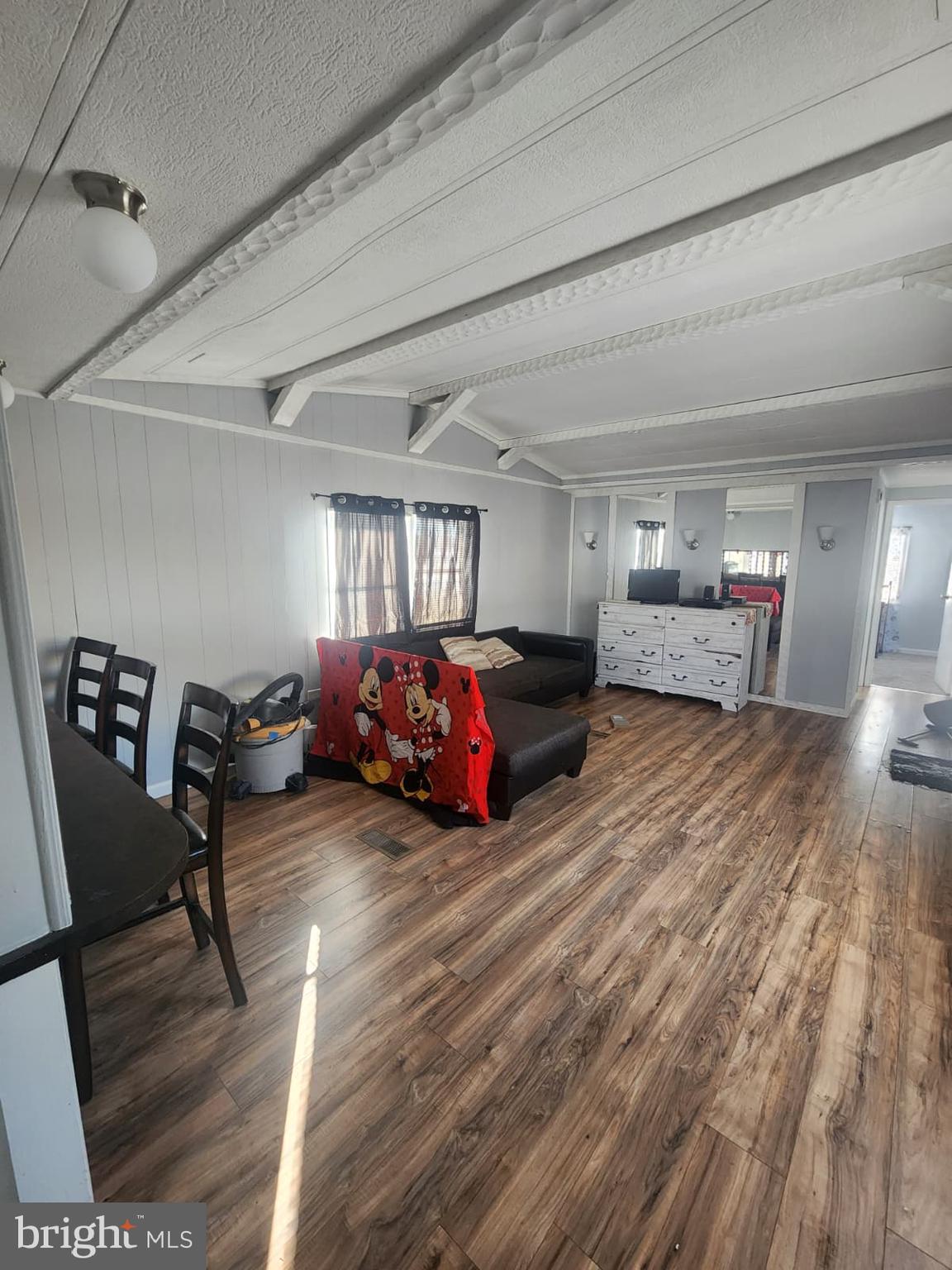 4191 Lake Road, Unit 28 Newfield, NJ 08344 - Photo 9 of 12 a living room with furniture and a wooden floor