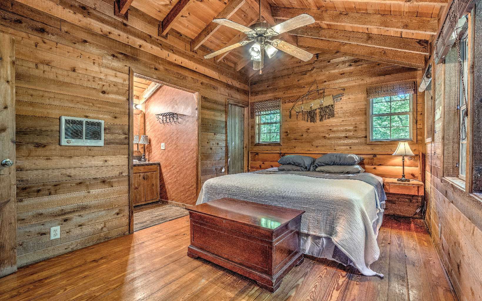 166 Nantahala Pass Road Blue Ridge, GA 30513 - Photo 11 of 40 a bedroom with a bed next to a large window with the outer view