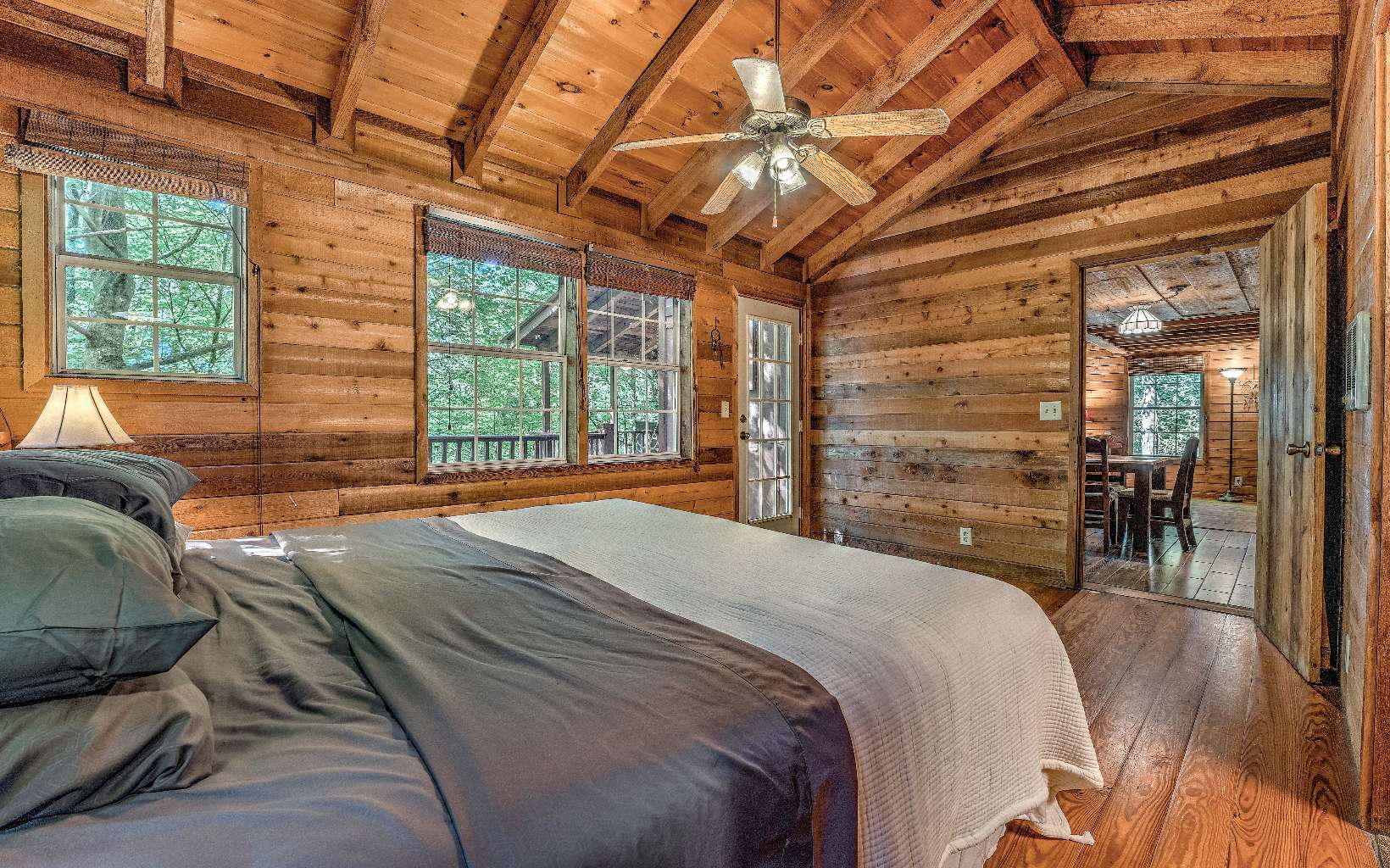 166 Nantahala Pass Road Blue Ridge, GA 30513 - Photo 12 of 40 a spacious bedroom with a bed and a large window