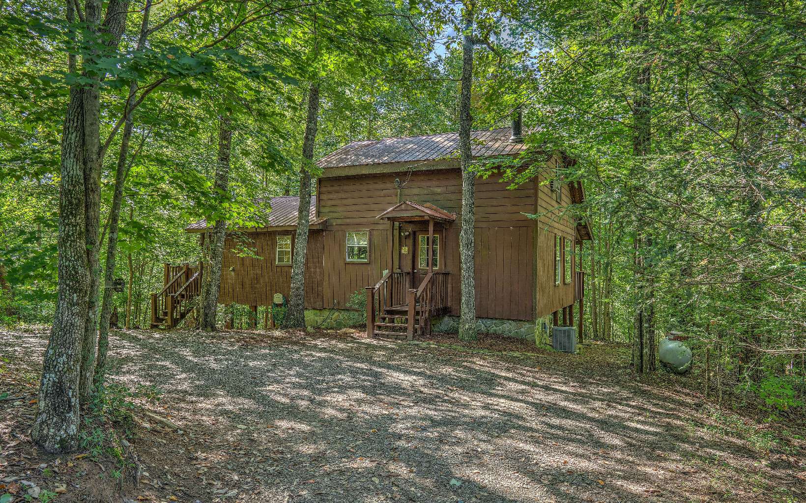 166 Nantahala Pass Road Blue Ridge, GA 30513 - Photo 2 of 40 a backyard of a house with seating area