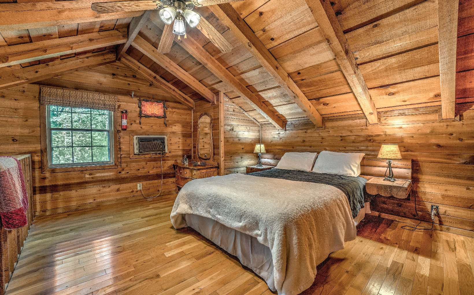 166 Nantahala Pass Road Blue Ridge, GA 30513 - Photo 26 of 40 a bed sitting in a bedroom next to a window