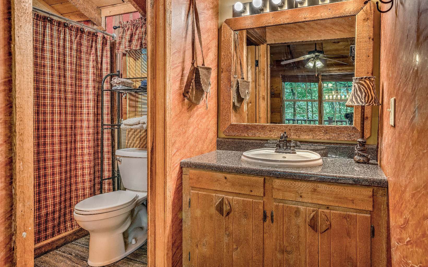 166 Nantahala Pass Road Blue Ridge, GA 30513 - Photo 8 of 40 a bathroom with a granite countertop sink toilet and shower