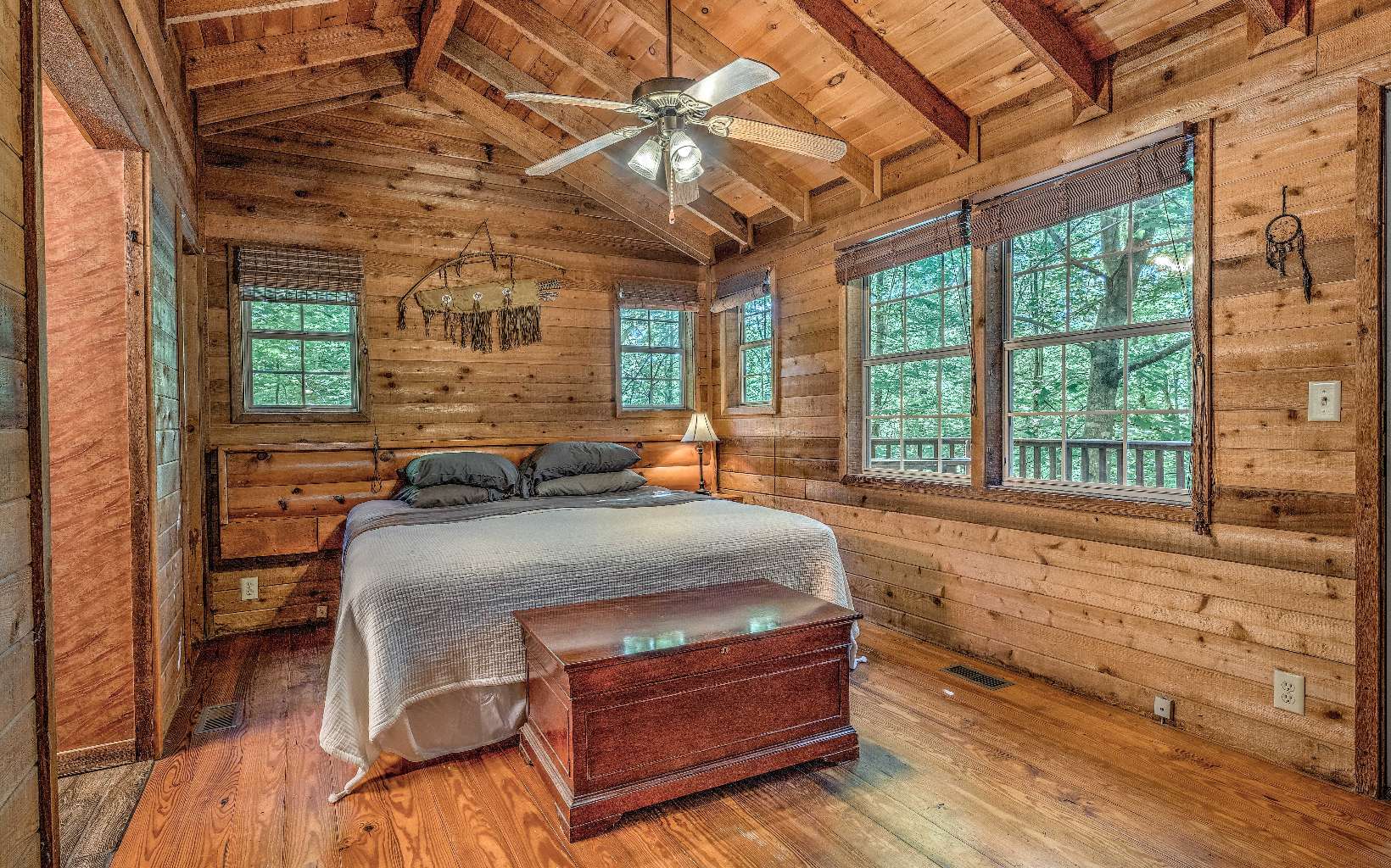 166 Nantahala Pass Road Blue Ridge, GA 30513 - Photo 10 of 40 a bed sitting in a spacious bedroom next to a window