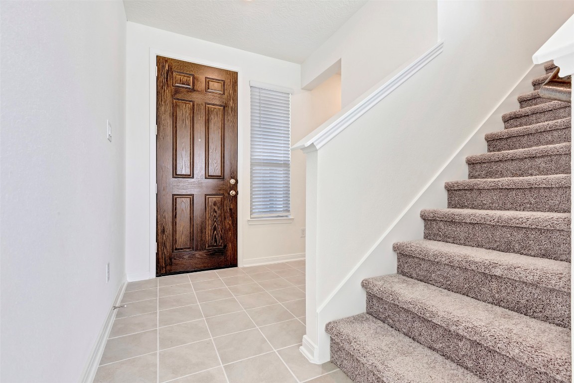9423 Castillo Court Magnolia, TX 77354 - Photo 4 of 28 Windows next to the front door fill the entry with beautiful natural light, creating a bright and welcoming first impression.