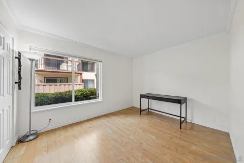 a view of an empty room with a window