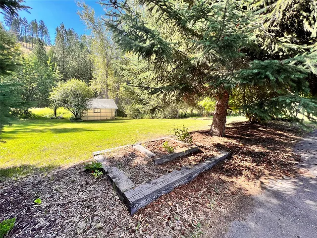 a view of a yard with an outdoor space