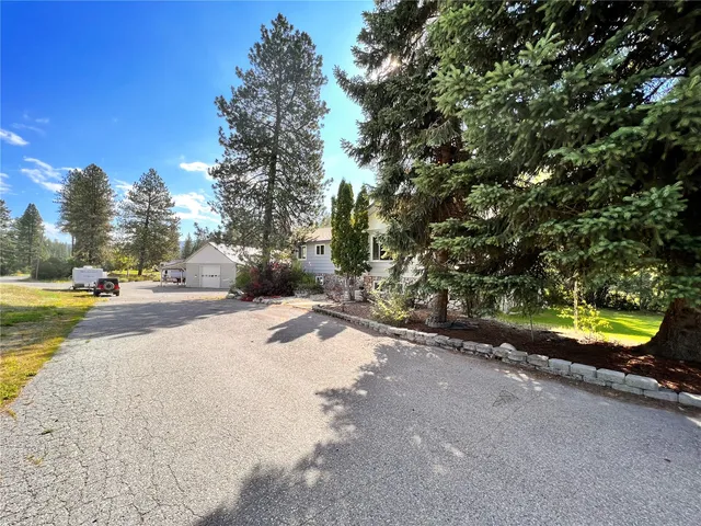 a view of a street with houses on both side of it