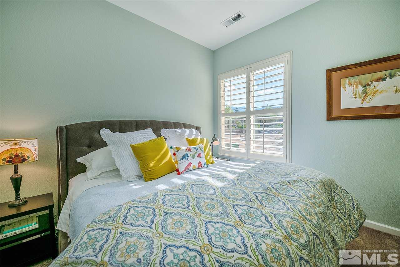 4935 Gila Bend Road Reno, NV 89511 - Photo 13 of 21 a bedroom with a bed and a window