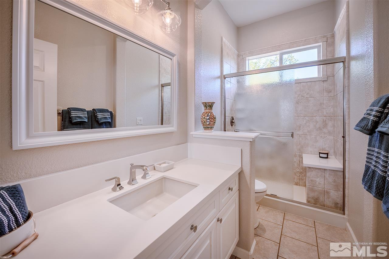 4935 Gila Bend Road Reno, NV 89511 - Photo 15 of 21 a bathroom with a sink and a mirror