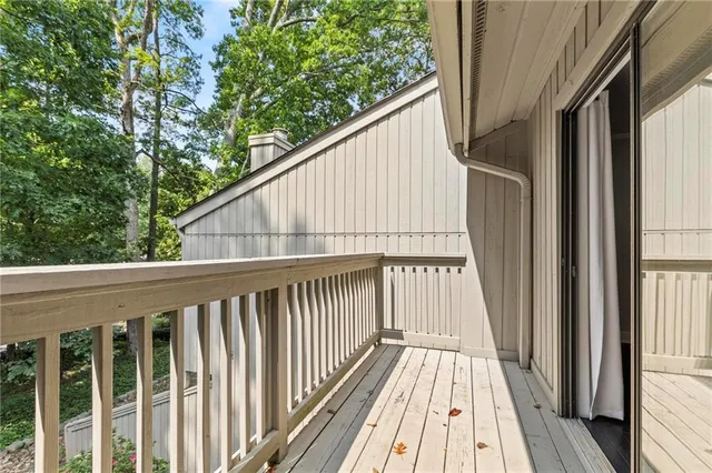 a view of balcony with wooden floor
