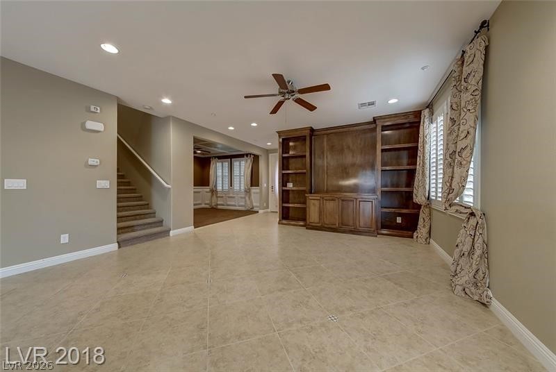 3144 Whitfeild Avenue Henderson, NV 89044 - Photo 13 of 55 Integrated shelving and built-ins complement the functional, tiled main living area.