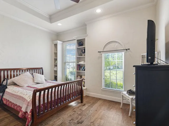 a bedroom with furniture and a window