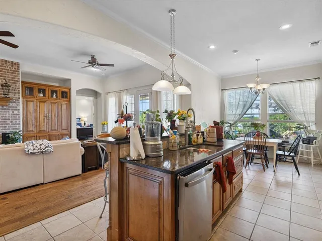 a kitchen island with granite countertop lots of counter top space
