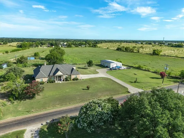 an aerial view of a house with a garden