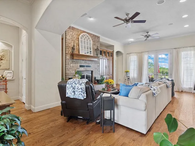 a living room with furniture rug and wooden floor