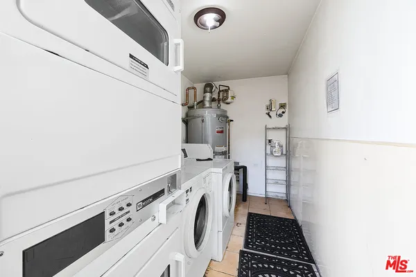 a view of storage and utility room with washer and dryer