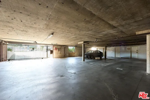 a view of a swimming pool with a patio and a yard