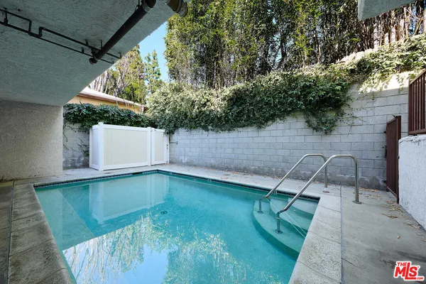 a view of a building with a garden