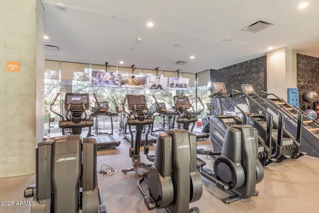 a view of a room with furniture and a floor to ceiling window