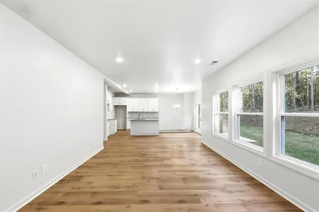 a view of a kitchen with a sink and cabinets