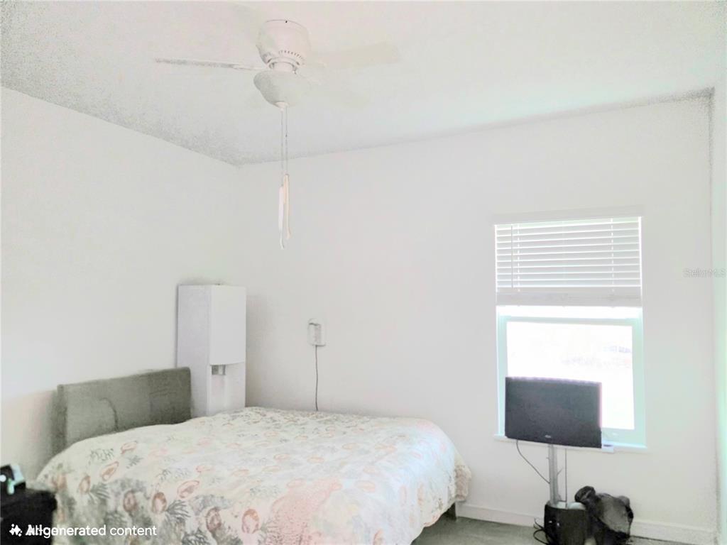 7875 Southwest 74th Street Ocala, FL 34474 - Photo 19 of 28 a bedroom with a bed and a window