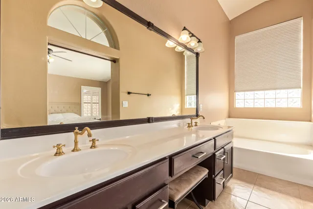 a white toilet sitting next to a bath tub