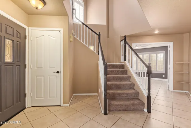 a view of entryway with stairs and wooden floor