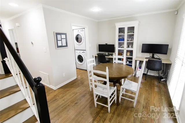 a view of a livingroom with furniture and a flat screen tv