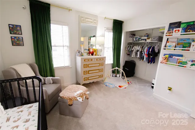 a bedroom with furniture and a wooden floor