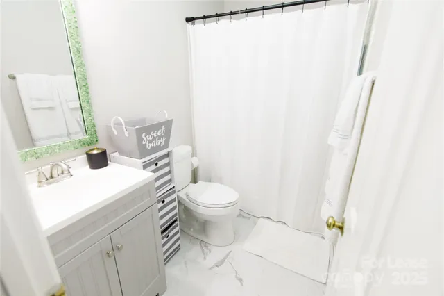 a view of a patio with iron fence