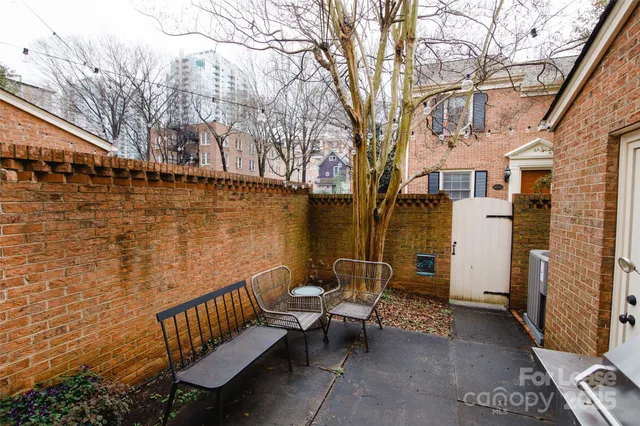 a view of a chair and table in the balcony