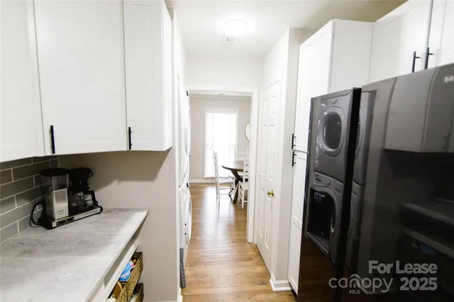 a kitchen with a refrigerator and a sink