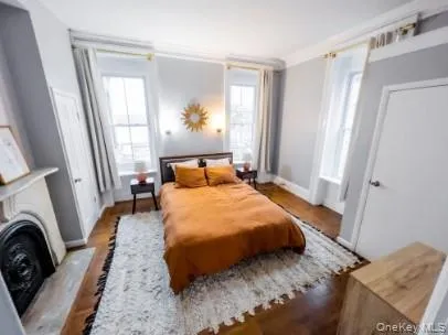 a bedroom with a bed and a mirror