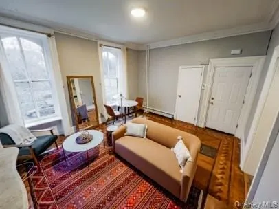 a living room with furniture and a window