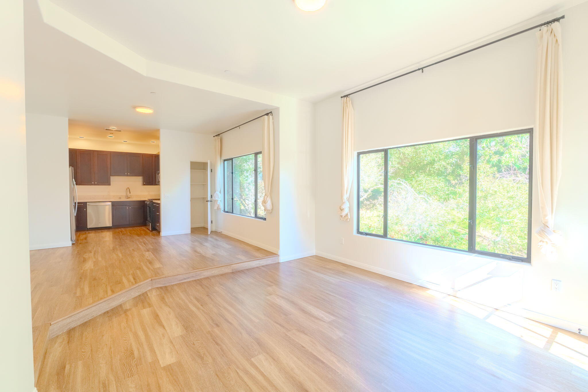 920 Lowena Drive, Unit 19 Santa Barbara, CA 93103 - Photo 6 of 21 a view of an empty room with a window and wooden floor