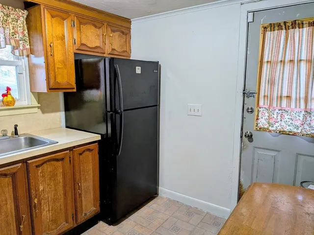a kitchen with stainless steel appliances a refrigerator and a stove