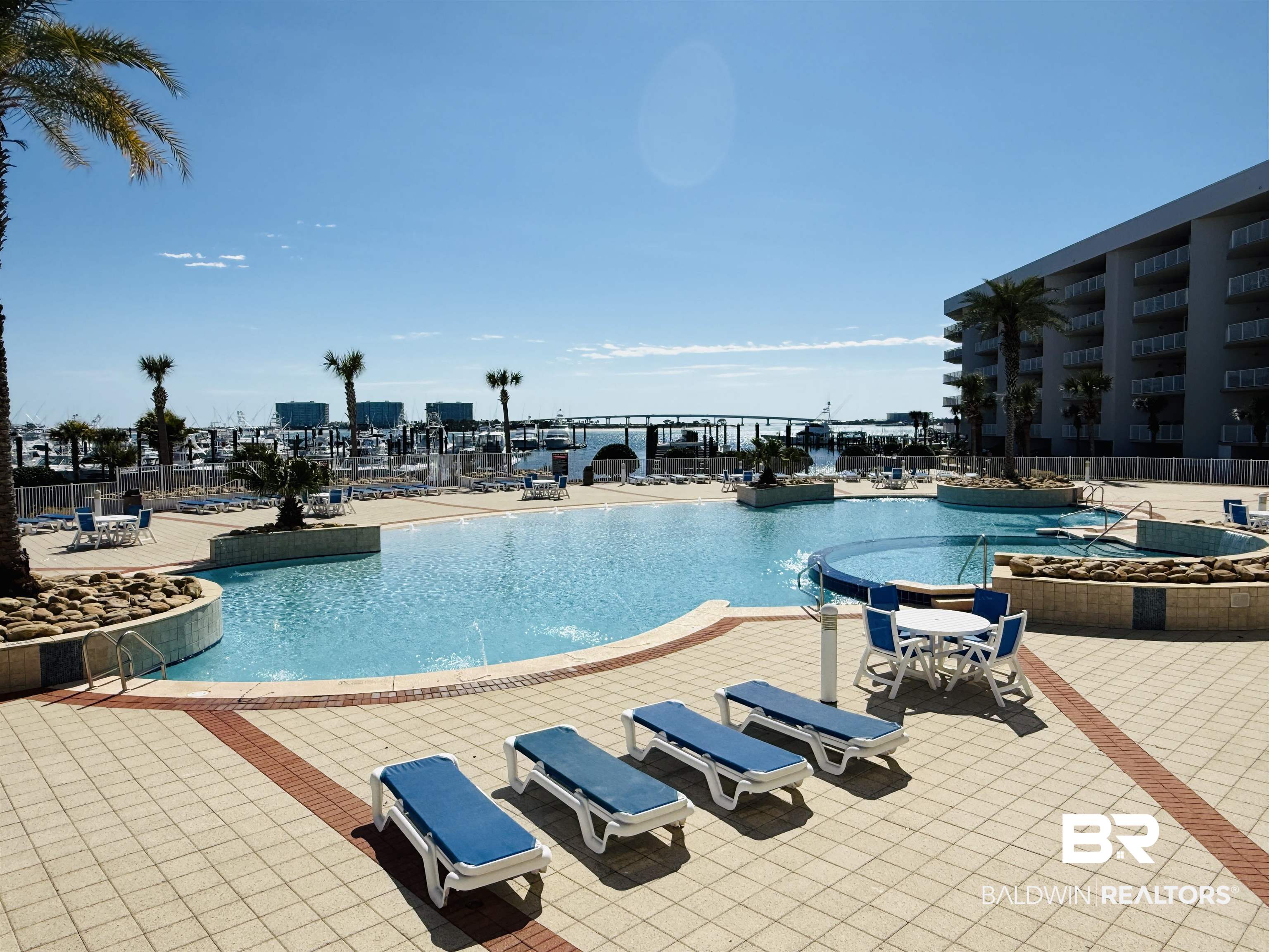 27800 Canal Road, Unit 409 Orange Beach, AL 36561 - Photo 6 of 22 Community pool featuring a patio area
