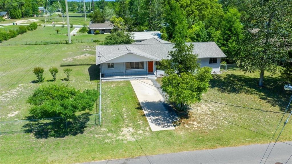 4367 Northeast 11th Street Ocala, FL 34470 - Photo 1 of 24 a aerial view of a house with a yard