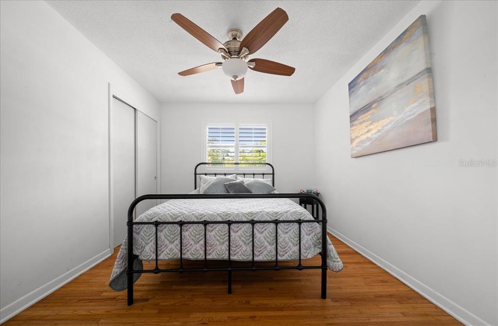 4367 Northeast 11th Street Ocala, FL 34470 - Photo 13 of 24 a bedroom with a bed and a table