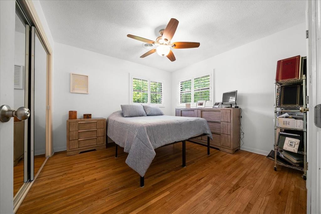 4367 Northeast 11th Street Ocala, FL 34470 - Photo 14 of 24 a spacious bedroom with a bed and a flat screen tv
