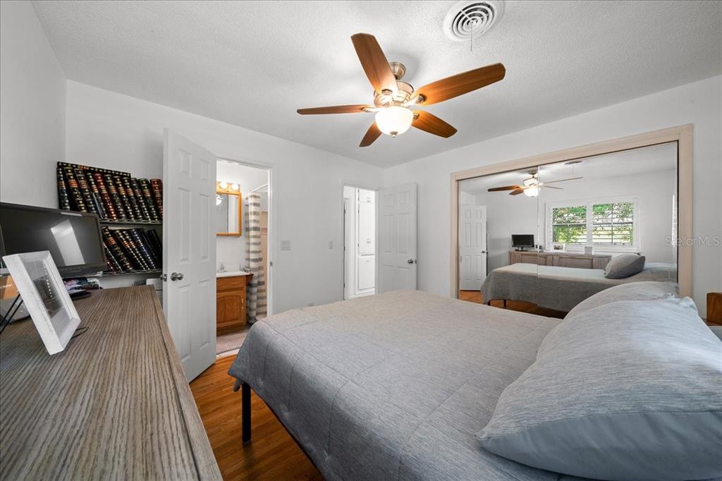 4367 Northeast 11th Street Ocala, FL 34470 - Photo 15 of 24 a bedroom with a bed and wooden floor